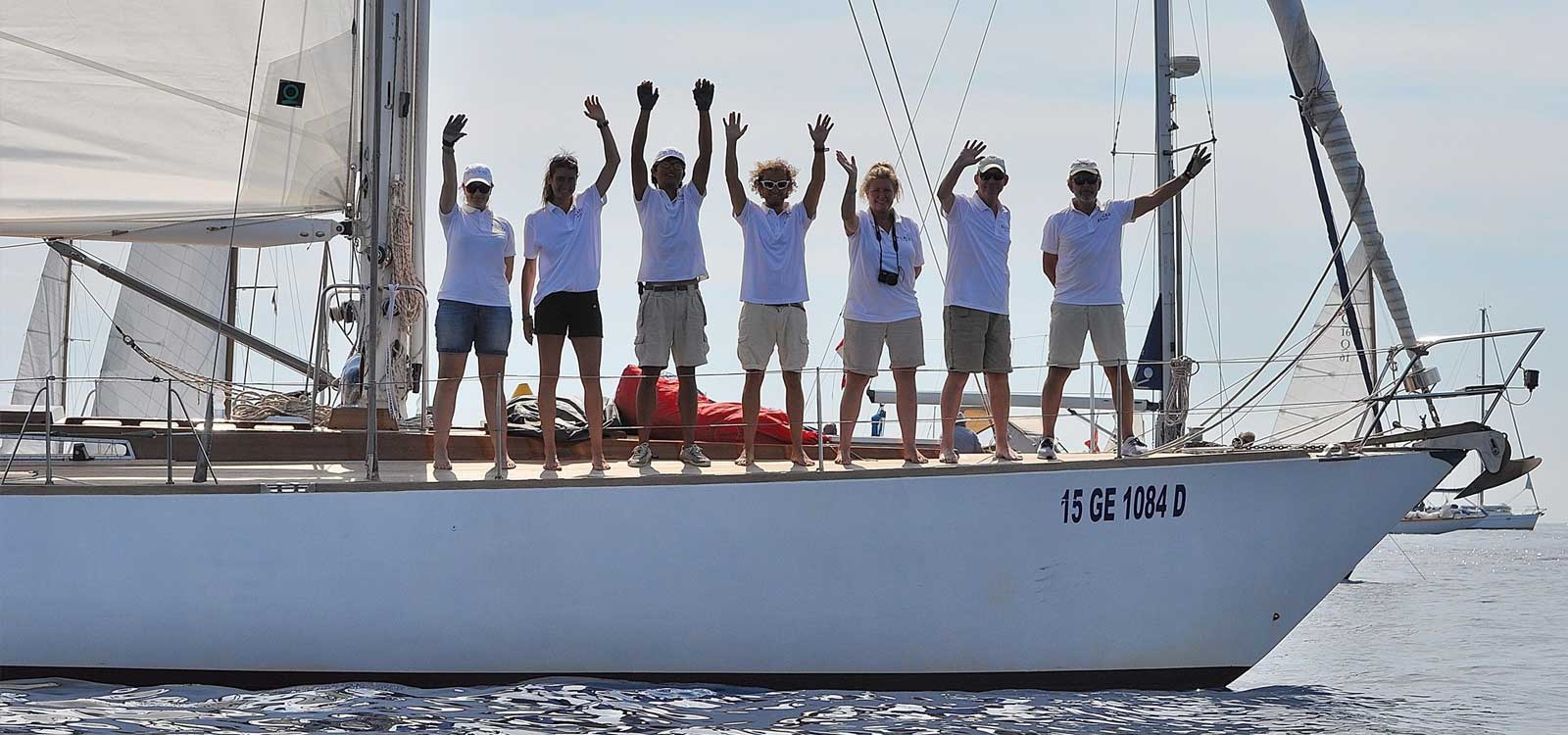 People on yacht waving